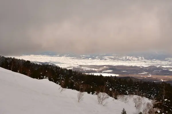 Snow landscape in hokkaido Japan bad weather coming in Clouds. High quality photo