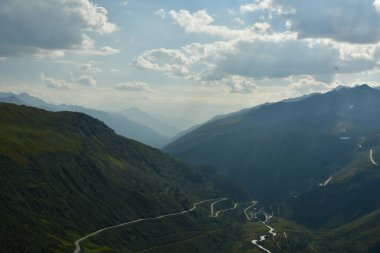 Alpine Road Grimsel Pass swizerland Alps curves europe Furkapass mountain scenery. High quality photo clipart