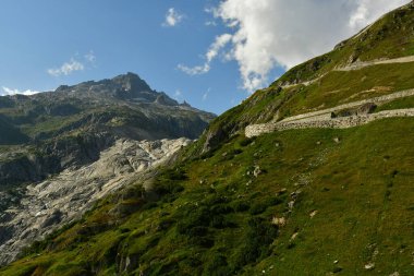 Alpine Road Grimsel Pass swizerland Alps curves europe Furkapass mountain scenery. High quality photo clipart