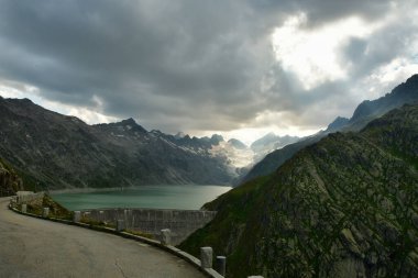 Alpine Road Grimsel Pass swizerland Alps curves europe Furkapass mountain scenery. High quality photo clipart