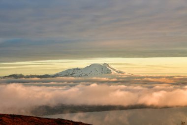 Sunset from Osorno Vulcan in winter refugio teskie views colorful orange blue. High quality photo clipart