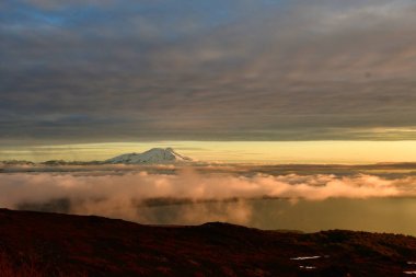 Sunset from Osorno Vulcan in winter refugio teskie views colorful orange blue. High quality photo clipart