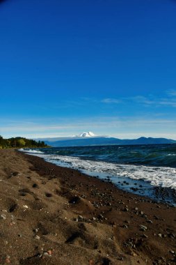 calbuco Vulcano patagonia chile from beach of lake Llanquihue. High quality photo clipart