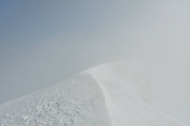 puyehue summit views in winter white out snow storm wind . High quality photo clipart