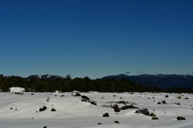 Llaima Vulcano in Conguillio national park patagonia chile snow landscape. High quality photo clipart