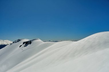 Chile ski panorama top touring mountaineering patagonia vulcano snow blue sky background. High quality photo clipart