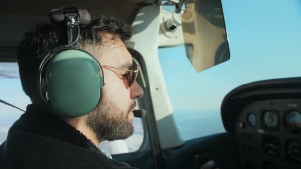 Airplane Pilot Flight Close Daylight Young Beard Man Wearing Headphones — Stock Video