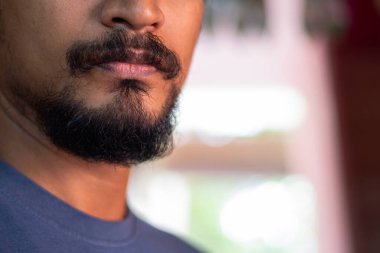 Close up of black beard young Indian man. Beautifully natural gr