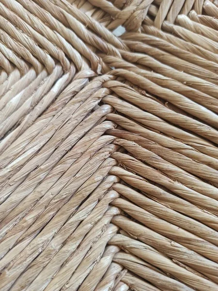Textured woven straw background in a chair seat