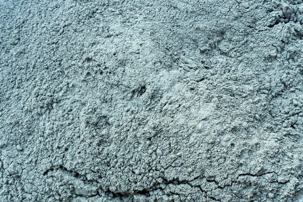 Gray wet cement powder on a construction building