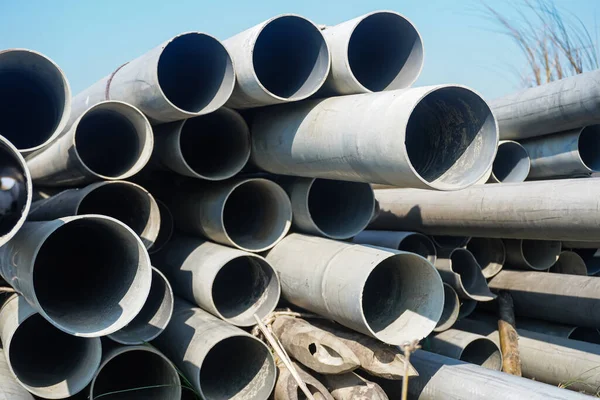 stock image Background of big plastic pipes used at the building site.The many big pipes on the ground. PVC pipes bacground