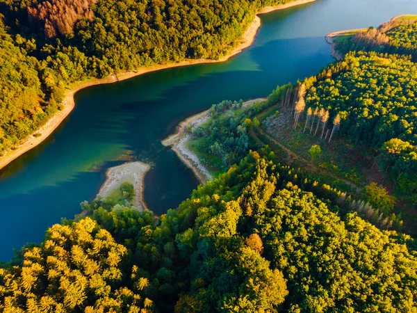 Aerial view of green mountains and river , view from above.
