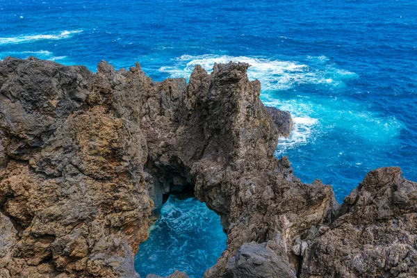 Natural pools with black volcanic rock in the Atlantic Ocean Porto Moniz, Madeira, Portugal