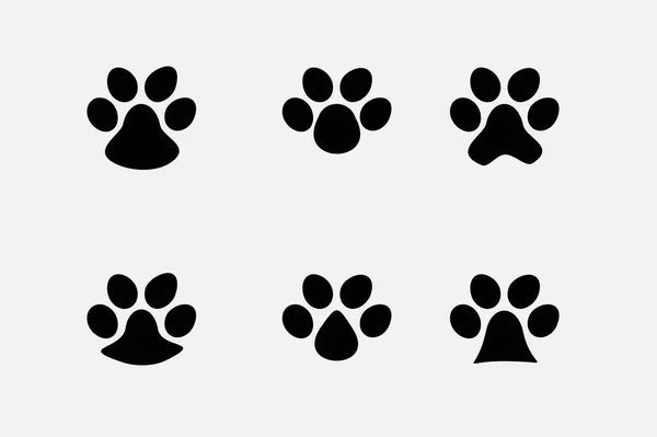 在白色背景上隔离的一组动物脚印 黑色脚印图标 平面风格 — 图库矢量图片