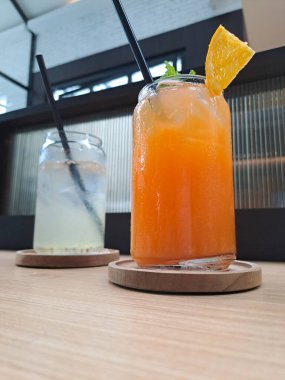 Orange and lime juice in glass, homemade, fresh and healthy