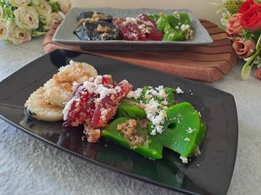 Cenil, traditional indonesian food. Made of cassava starch and glutinous rice flour with sweet flavor and chewy texture. Usually served with grated coconut, brown sugar sauce and lupis.