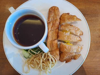 Pempek, a savoury Indonesian fishcake served with sweet and sour vinegar sauce. Made of fish and tapioca, from Palembang, South Sumatra, Indonesia