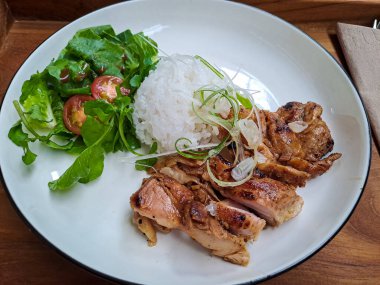 Grilled chicken, salad and white rice, a combination of low calorie menu for diet