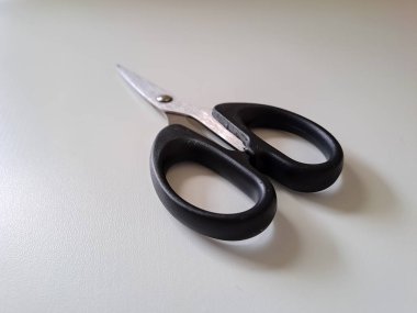 Close up view of scissors in isolated white background. soft focus