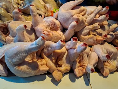Raw chicken meat in the butcher shop. Fresh or uncooked meat for sale in the traditional market. Selective focus