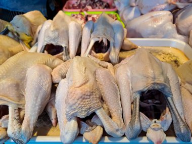 Raw chicken meat in the butcher shop. Fresh or uncooked meat for sale in the traditional market. Selective focus