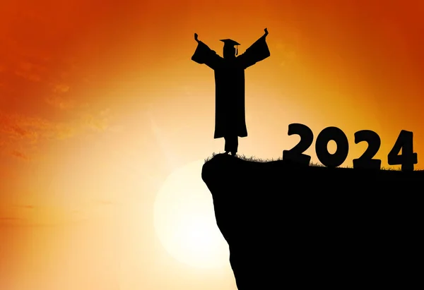 Silhouette Young man Graduation in 2024 years, education congratulation concept , Freedom and Happy new year, copy space.