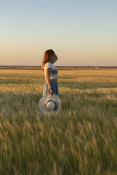 stock image girl in the field with wheat planting