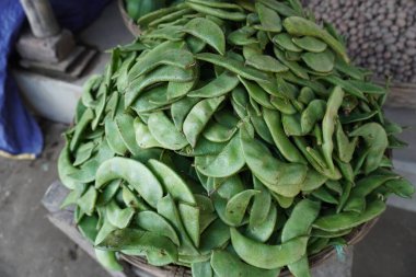 sweet pea in basket. Fresh green peas.fresh green Pisum sativum seed in market