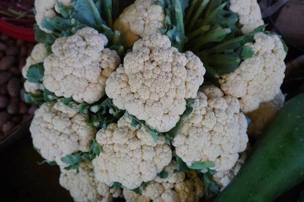 Cauliflower group from marketplace . Blumenkohl . cauliflower stock with green leaf .
