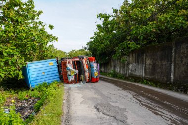 Makassar, November 21, 2022: View of an overturned truck at daeng takalia street in the suburbs of Makassar with copy space