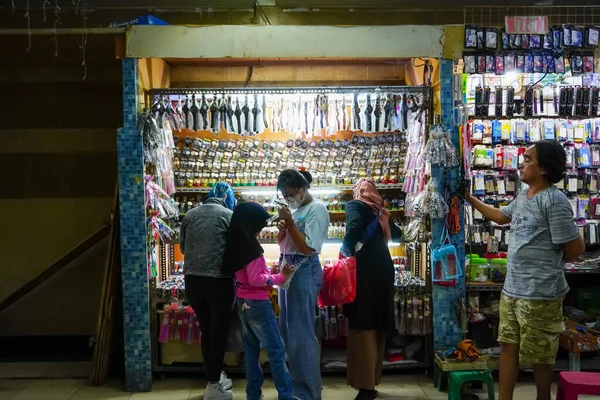 stock image Shopping for watches with teenage girls at street vendor in Kota Tua, North Jakarta on January 23, 2023