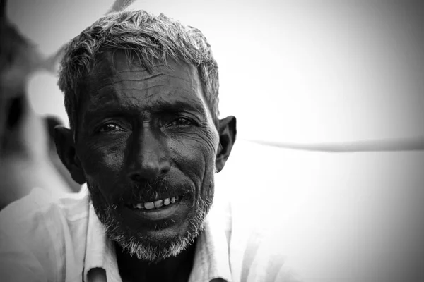 stock image Vadodara, Gujarat - November 19th 2022: Aged Indian man close up face with wrinkled skin and grey hair good and beautiful face smoking