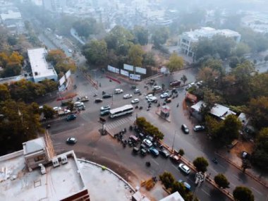 Time lapse Cars vehicles crossing interjunction busy road crossing drone aerial top angle view