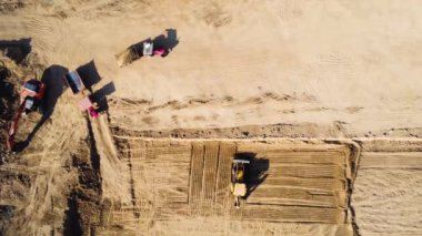 Construction industrial machinery excavator tractor sand pit aerial drone view shot top angle