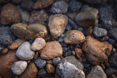 The erosion of water on the rocks, textures and patterns generated on the stones of the beach Ibiza island.