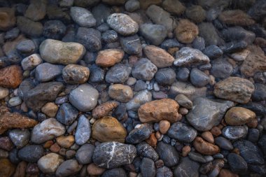 The erosion of water on the rocks, textures and patterns generated on the stones of the beach Ibiza island.
