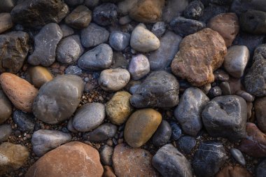The erosion of water on the rocks, textures and patterns generated on the stones of the beach Ibiza island.