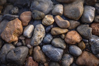 The erosion of water on the rocks, textures and patterns generated on the stones of the beach Ibiza island.