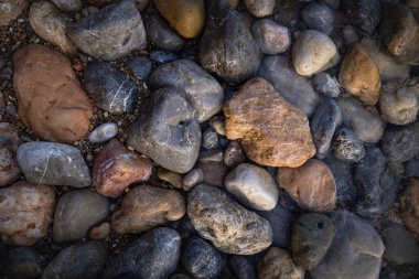 The erosion of water on the rocks, textures and patterns generated on the stones of the beach Ibiza island.