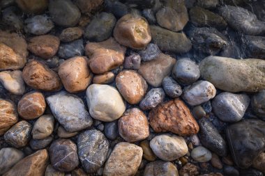 The erosion of water on the rocks, textures and patterns generated on the stones of the beach Ibiza island.