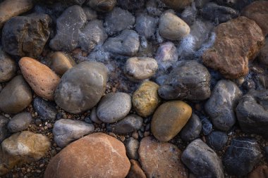 The erosion of water on the rocks, textures and patterns generated on the stones of the beach Ibiza island.
