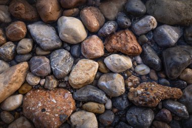 The erosion of water on the rocks, textures and patterns generated on the stones of the beach Ibiza island.