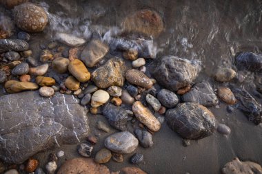 The erosion of water on the rocks, textures and patterns generated on the stones of the beach Ibiza island.