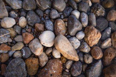 The erosion of water on the rocks, textures and patterns generated on the stones of the beach Ibiza island.