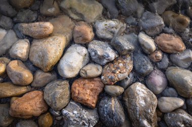 The erosion of water on the rocks, textures and patterns generated on the stones of the beach Ibiza island.