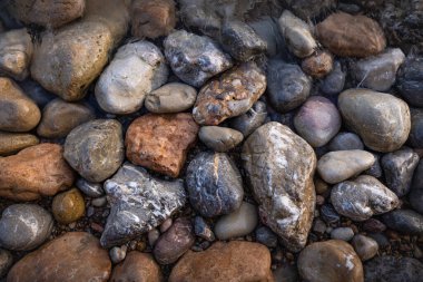 The erosion of water on the rocks, textures and patterns generated on the stones of the beach Ibiza island.