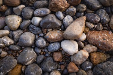 The erosion of water on the rocks, textures and patterns generated on the stones of the beach Ibiza island.