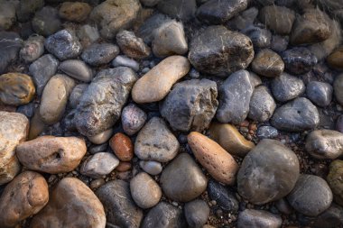 The erosion of water on the rocks, textures and patterns generated on the stones of the beach Ibiza island.
