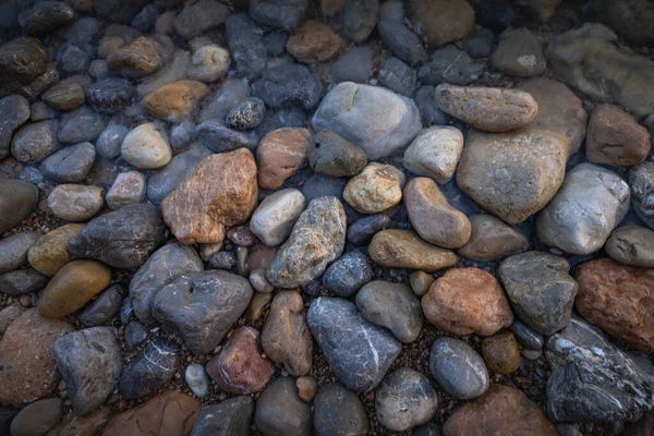 The erosion of water on the rocks, textures and patterns generated on the stones of the beach Ibiza island.