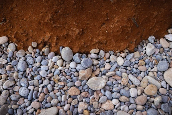 The erosion of water on the rocks, textures and patterns generated on the stones of the beach Ibiza island.
